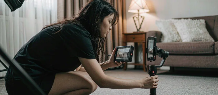 A phone gimbal rig and monitor on a small vertical short-drama set